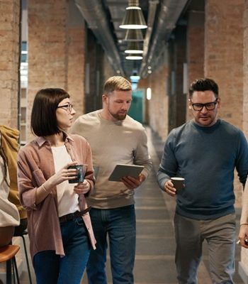 pexels-3182787 Business Team Walking Down Hallway